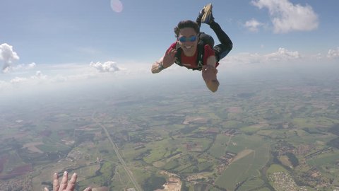 Happy parachutist in free fall - point of view