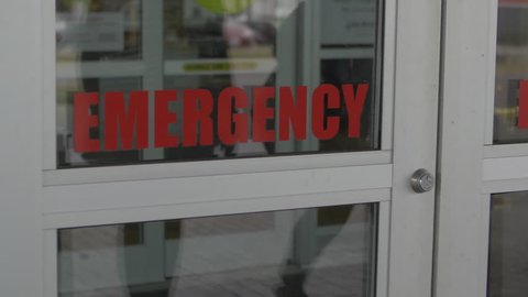 Automatic emergency door opening and closing as two women walk in