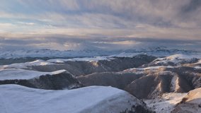 Russia, time lapse. Winter views of the snowy mountains of the Caucasus. Formation and movement of clouds over mountains peaks. 