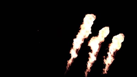 Three Fire Throwers with a Different Angle of Emission in Slow Motion on Black Background