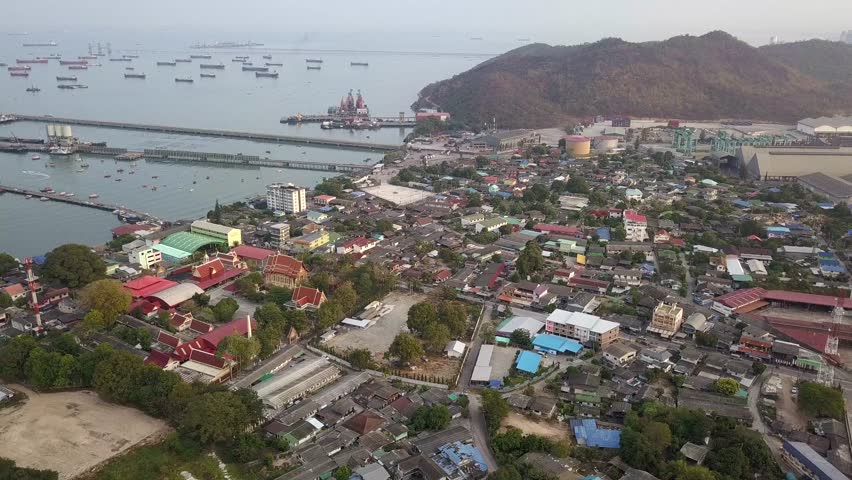 Aerial view of logistics and transportation, Pier dock, surrounded with community house.