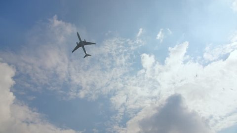 The plane takes off against a blue sky.