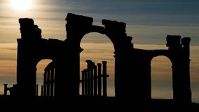 Palmyra, Syria: The Monumental Arch,  Arch of Triumph at Sunset, was a Roman ornamental archway - Powered by Shutterstock - Get 15% off with code: PIKWIZARD15