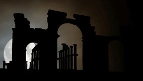 Palmyra, Syria: The Monumental Arch, also called the Arch of Triumph by Night with Full Moon, was a Roman ornamental archway. Its Ruins was officially destroyed by the Islamic State - Powered by Shutterstock - Get 15% off with code: PIKWIZARD15