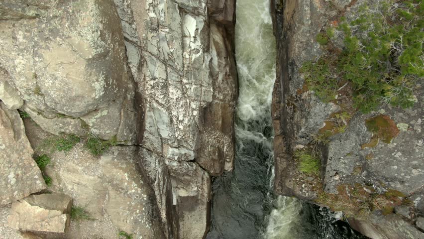 Aerial of small waterfall in river in Colorado, late summer