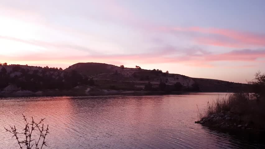 A beautiful sunset at a magical dam in cyprus