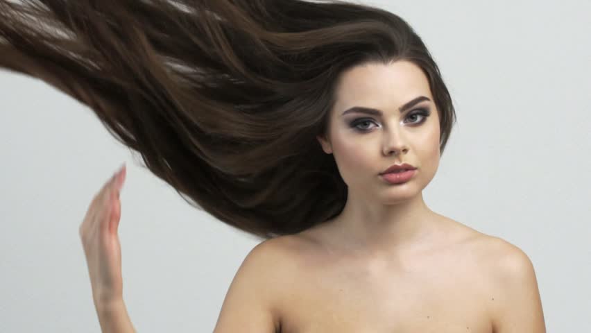 Beautiful woman with long brown hair. Attractive fashion model with fluttering hair.  Beautiful brunette woman.  Slow motion footage.  | Shutterstock HD Video #1024513025