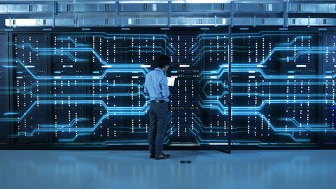 IT Specialist Standing In front of Server Racks with Laptop, He Activates Data Center with a Touch Gesture. Animated Concept of Digitalization of Information: Network of Lines Spreading Symmetrically