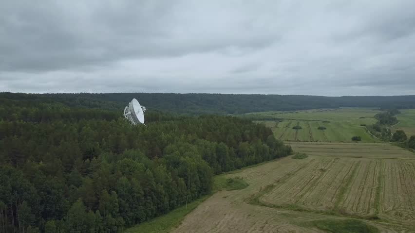 Aerial view. Flight around radio telescope in observatory. Greean forest and glade. Royalty-Free Stock Footage #1024516142