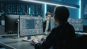 Smart Female IT Programer Working on Desktop Computer in Data Center System Control Room. Team of Young Professionals Doing Code Programming - Powered by Shutterstock - Get 15% off with code: PIKWIZARD15