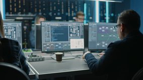 Team of IT Programers Working on Desktop Computers in Data Center Control Room. Young Professionals Writing on Sophisticated Programming Code Language - Powered by Shutterstock - Get 15% off with code: PIKWIZARD15