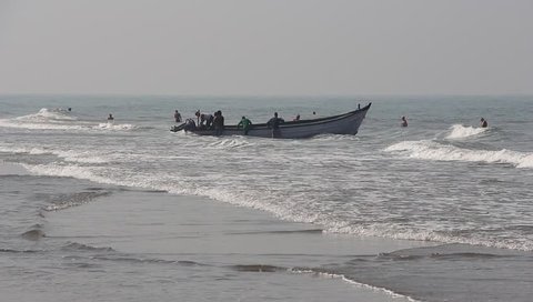 Arambol, Goa, India - Circa February, 2019. Fishermen on the Arambol beach.