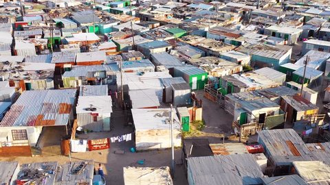 GUGULETHU, SOUTH AFRICA - CIRCA 2018 - Aerial over ramshackle tin roofs of Gugulethu, one of the poverty stricken slums.