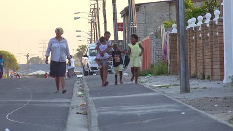 GUGULETHU, SOUTH AFRICA - CIRCA 2018 - People walk on the streets in the Gugulethu township in South Africa.