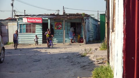 GUGULETHU, SOUTH AFRICA - CIRCA 2018 - Establishing shots of a typical township in South Africa, Gugulethu, with tin huts and poverty.