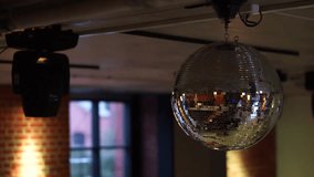 Bright party discoball. Fun and night life. Night club, disco. Bright decorations in a nightclub, restaurant or cafe.