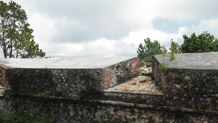 Aerial View Stone Walls of Citadel in Haiti & Cloudy Sky Behind