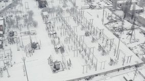 Arial view: High voltage power lines in the winter. Thermal power plant. High-voltage transformer substation. Electrical substation - Powered by Shutterstock - Get 15% off with code: PIKWIZARD15