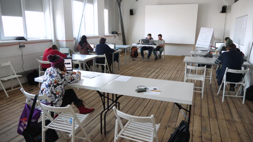 Lecturing process. Examination. Media school concept. Professor taking exam. Lecturing hall background. High school, college, university classes. Students and teacher in classroom. Animation school