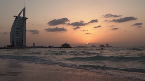 Waves on Dubai Beach During Sunset Slow Motion Burj Al Arab in the background