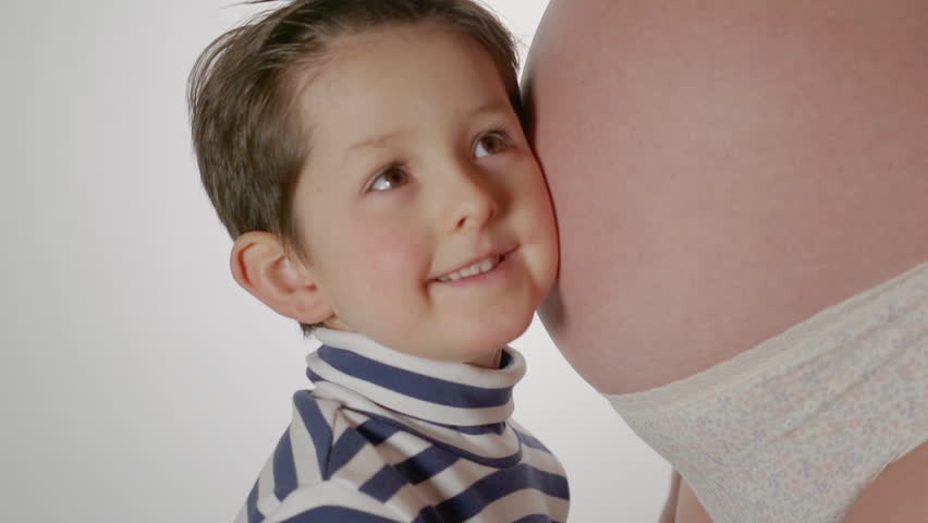 Little Boy Hugging Mothers Pregnant Stock Footage Video (100% Royalty
