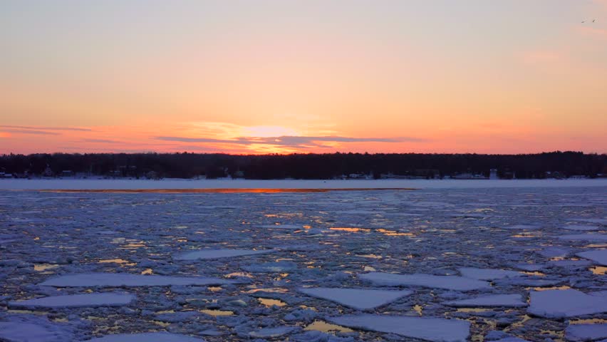 Slow pull from sunset with birds flying, Sturgeon Bay Wisconsin