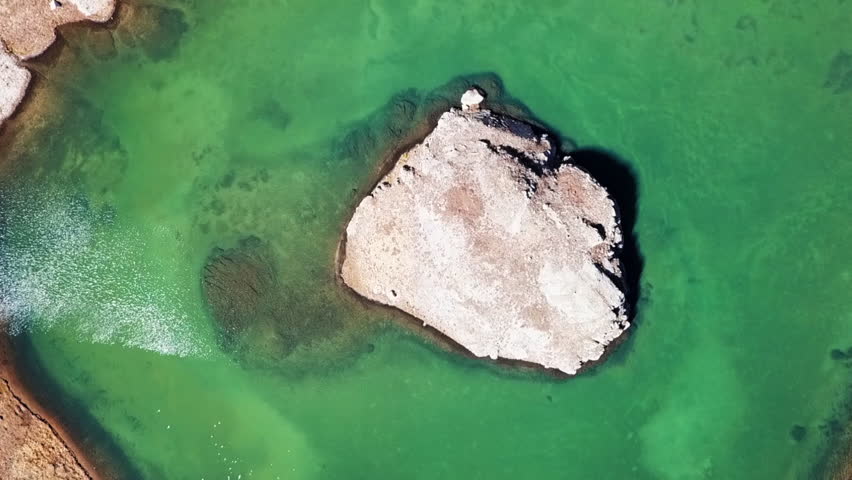 Aerial Rise: Lake with Small Island in the Middle in USA