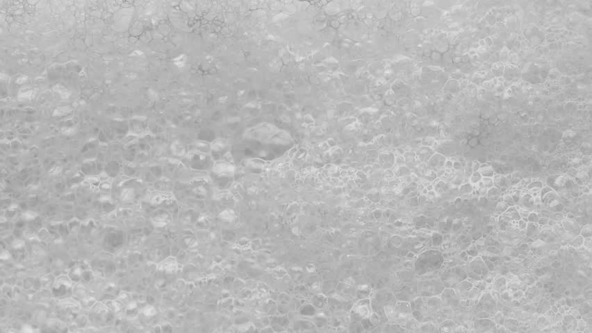 White Foam With Bubbles Popping Royalty-Free Stock Footage #1024635953