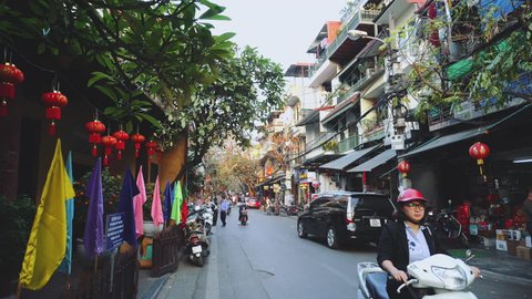 Hanoi, Vietnam - FEBRUARY 15, 2019: Motorcycle Traffic Pass Through Old Town, Hanoi Vietnam 4K