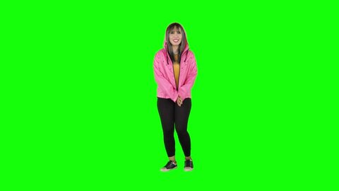 Attractive female modern style dancer performing in the studio. Shot in 4k resolution with green screen background