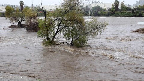 Very flooded Los Angeles River after several days of rain.