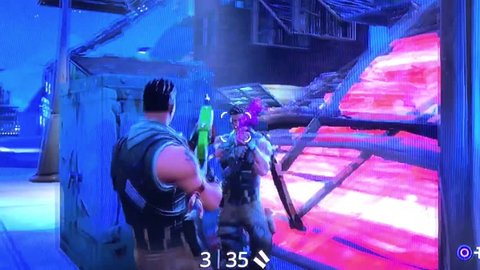 Video Game Playing Fortnite from epic games Closeup Footage. Playing popular game with big tv screen. 24th February 2019. Finland, Espoo.