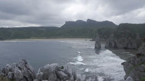 Landscape view of Cape Hedo, the northernmost point on Okinawa Island with the pacific sea in strong wind with cloudy weather, Okinawa, Japan - Tropical sea