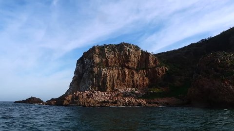The view from a small vessel cruising out of the Knysna Heads on the Indian ocean. Captured in Knysna while on a whale watching trip in the Western Cape region of South Africa