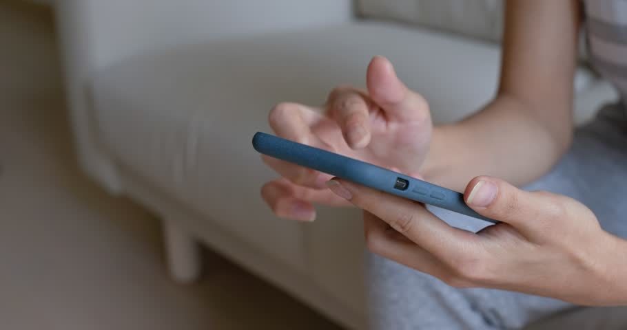 Woman use of mobile phone at home