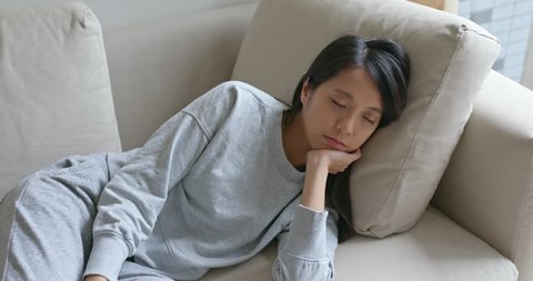 Woman sleep on sofa at home