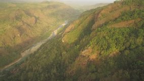 Aerial footage view cliff of MANGUNAN hills in Yogyakarta countryside, Indonesia