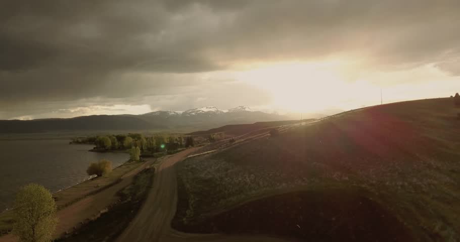Mesmerizing beautiful sunset over Ennis Lake at Bear Trap Canyon Montana landscape at golden hour
(drone shot)