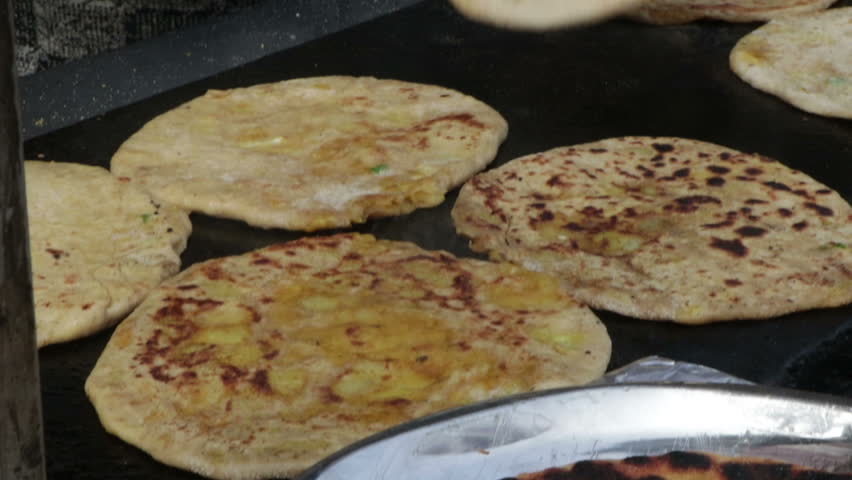 Rolling chapati with roller in kitchen with hands. Food & Drink Videos ...