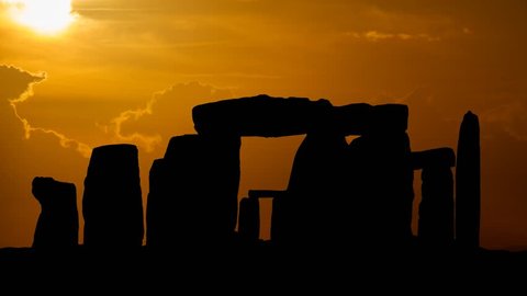 Silhouette over Stonehenge at Sunset, an ancient prehistoric monument consists of a ring of standing stones near Salisbury, Wiltshire, England, UK