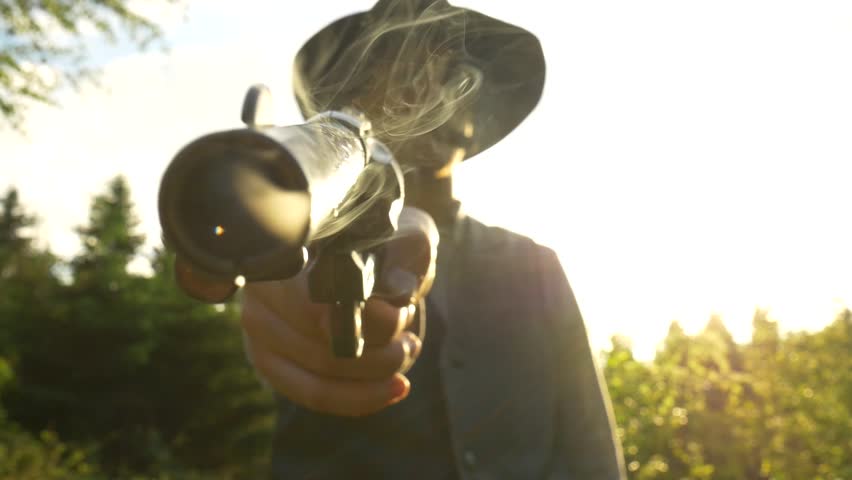 Cowboy point his revolver. Out of the revolver comes smoke.