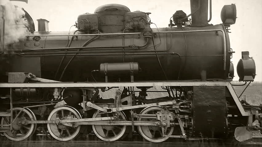 Old passangers train running on the tracks. Retro locomotive with steam engine loopable black and white footage. Royalty-Free Stock Footage #1024700111
