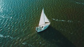 view yachting of waves under blue Sea in summer sunny day, Drone 4K Video.