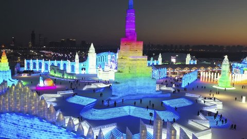 Harbin, China - January 8, 2019: Ice building. Harbin International Ice and Snow Sculpture Festival. People are visiting. Located in China Harbin Ice and Snow World, Harbin, Heilongjiang, China.