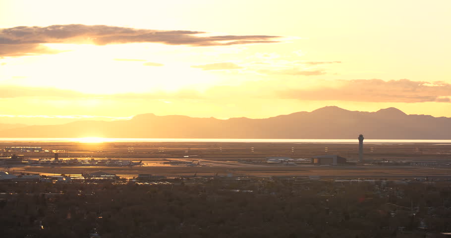 
The sun sets over the mountains behind the Salt Lake City airport.