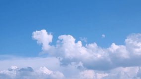 Blue sunny, lightness sky, time lapse rolling, fast moving clouds in summer. Beautiful weather, fluffy, puffy forming, building cloudscape in horizon. -UHD.