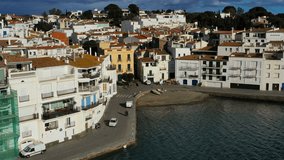 Cadaques Spain. Aerial drone video footage of the camera approaches the city. sunny daylight.