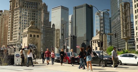 Chicago, Illinois, USA - September 25, 2018: Cars and people walk across the DuSable Bridge over the Chicago River in downtown Chicago Illinois USA during a summer day
