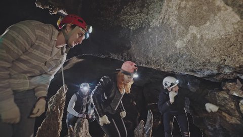 Speleologists or geologists checking a cave