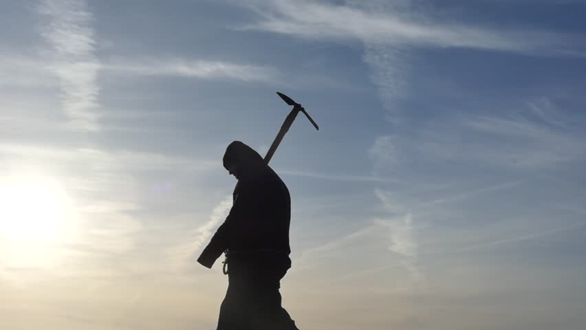 black ancient hoodie human with pickaxe horizontal motion silhouette